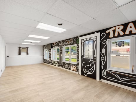 An image featuring building, hall, fixture, floor, flooring, window, wood, art, ceiling, hardwood at 302 N Keystone Ave.
