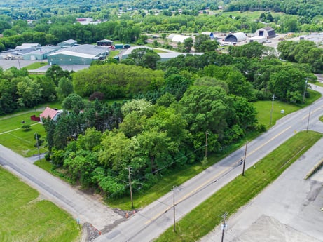 An image featuring plant, green, tree, land lot, urban design, grass, slope, residential area, groundcover, real estate at 1040 Center St.