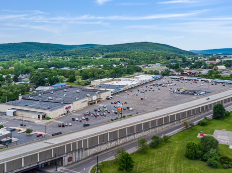 An image featuring sky, cloud, daytime, plant, infrastructure, tree, building, thoroughfare, urban design, mountain at 1040 Center St.