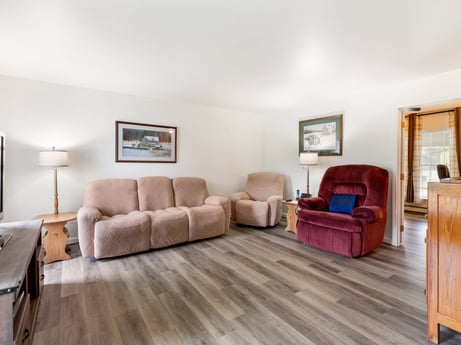 An image featuring brown, picture frame, furniture, comfort, wood, building, living room, flooring, fixture, floor at 105 Thomas St.