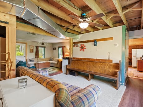 An image featuring furniture, property, table, wood, comfort, interior design, architecture, floor, flooring, hardwood at 1039 Old Bernice Rd.