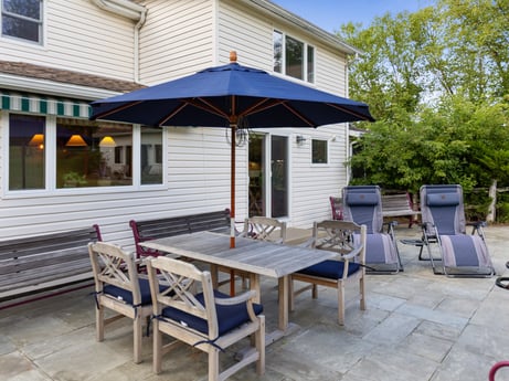 An image featuring property, building, furniture, window, table, shade, outdoor furniture, outdoor table, road surface, chair at 130 Haighs Pond Rd.