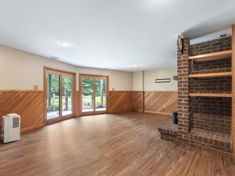 An image featuring building, furniture, wood, living room, interior design, flooring, wood stain, hall, floor, plant at 276 Mountain View Ln.