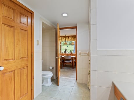 An image featuring property, door, building, wood, fixture, interior design, flooring, floor, wall, hardwood at 130 Haighs Pond Rd.