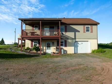 An image featuring sky, cloud, property, window, building, plant, land lot, tree, house, cottage at 85 View Rd.