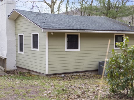 An image featuring window, building, plant, fixture, sky, wood, house, land lot, cottage, siding at English Hollow Ln.
