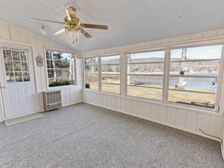 An image featuring ceiling fan, building, wood, window, interior design, shade, floor, beam, mechanical fan, flooring at 199 S Lake Rd.