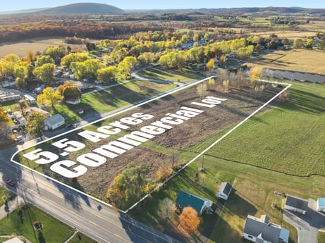 An image featuring plant, sky, land lot, tree, urban design, grass, natural landscape, landscape, city, road at Elm Dr.