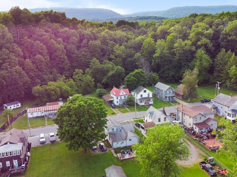 An image featuring sky, plant, cloud, tree, building, natural landscape, land lot, highland, grass, house at 138 T-329.