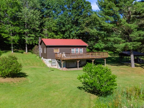 An image featuring plant, building, window, tree, natural landscape, house, wood, cottage, grass, real estate at 735 Midnight Ln.
