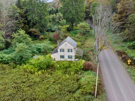 An image featuring plant, window, plant community, natural landscape, highland, tree, land lot, house, woody plant, slope at Nordmont Rd.