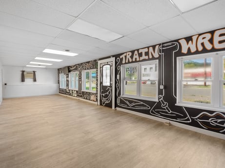 An image featuring building, floor, flooring, hall, fixture, window, ceiling, art, wood, glass at 302 N Keystone Ave.