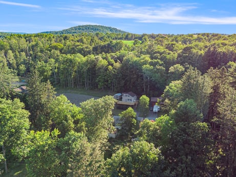 An image featuring cloud, sky, natural landscape, tree, highland, plant, landscape, mountainous landforms, grassland, grass at 127 Shore Dr.