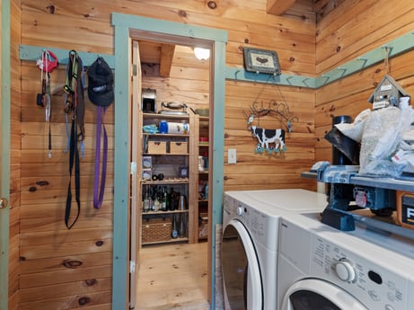 An image featuring laundry room, washing machine, property, clothes dryer, wood, laundry, hardwood, flooring, machine, sculpture at 1761 Brick House Rd.