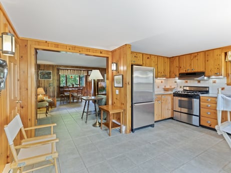 An image featuring cabinetry, furniture, building, chair, wood, kitchen appliance, countertop, drawer, flooring, house at 130 Haighs Pond Rd.