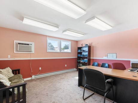An image featuring furniture, table, building, chair, desk, real estate, ceiling, bookcase, comfort, flooring at 213 Main St.