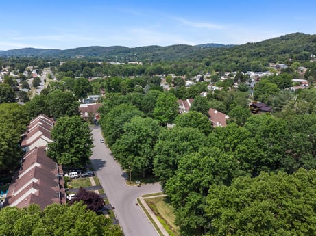 An image featuring sky, cloud, building, plant, tree, land lot, urban design, mountain, natural landscape, residential area at 2678 Haas Ln.