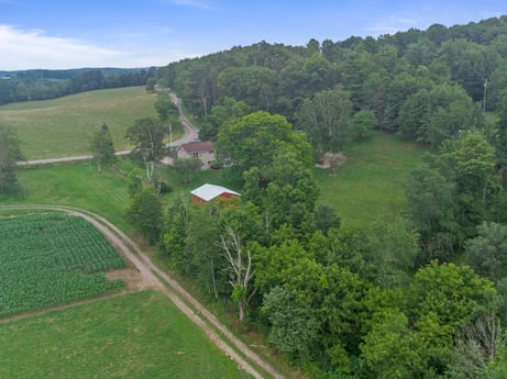 An image featuring sky, plant, cloud, natural landscape, tree, land lot, slope, grass, grassland, plain at 3869 Sportsmans Rd.