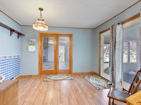 An image featuring property, fixture, wood, hall, interior design, architecture, flooring, window, floor, door at 1195 Twin Cuts Rd.