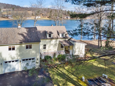 An image featuring water, sky, plant, building, window, tree, house, lake, land lot, wood at 199 S Lake Rd.