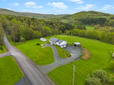 An image featuring sky, cloud, plant, natural environment, natural landscape, tree, land lot, slope, grass, urban design at 993 Dieffenbach Rd.