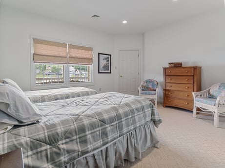 An image featuring property, furniture, building, comfort, wood, cabinetry, drawer, bed frame, house, window at 218 Point Rd.