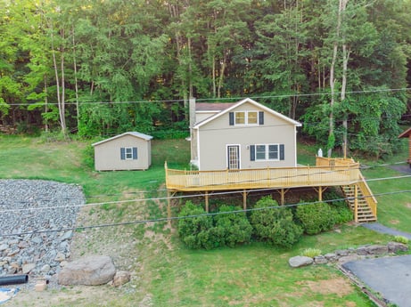 An image featuring plant, building, window, tree, house, wood, natural landscape, land lot, cottage, biome at 127 Shore Dr.