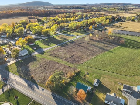 An image featuring plant, sky, tree, land lot, natural landscape, building, grass, urban design, grassland, plain at Elm Dr.