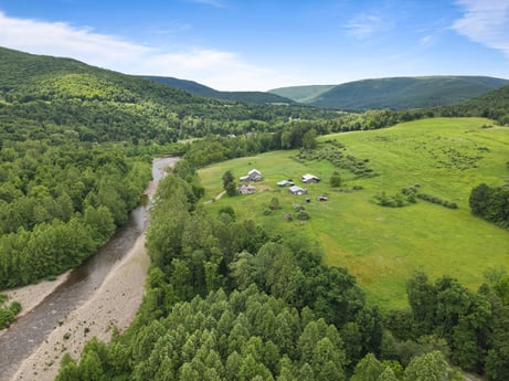 An image featuring cloud, sky, plant, mountain, green, natural landscape, tree, highland, land lot, grass at 709 Creek Rd.
