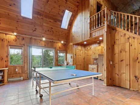 An image featuring property, furniture, building, table tennis racket, window, table, wood, sports equipment, interior design, house at 130 Haighs Pond Rd.