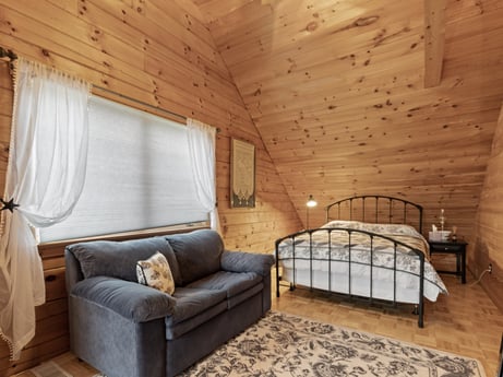 An image featuring property, building, comfort, wood, interior design, floor, curtain, flooring, hardwood, tints and shades at 1761 Brick House Rd.