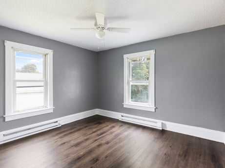 An image featuring window, property, fixture, building, wood, interior design, ceiling fan, shade, flooring, hall at 203 Harrison St.