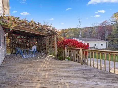 An image featuring cloud, sky, plant, building, flower, wood, road surface, tree, flowerpot, house at 2266 Liberty Corners Rd.