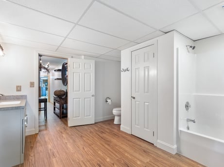 An image featuring building, door, fixture, wood, hall, cabinetry, flooring, floor, hardwood, laminate flooring at 276 Mountain View Ln.