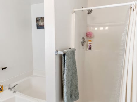 An image featuring property, bathtub, fixture, building, house, plumbing fixture, fluid, bathroom, floor, flooring at 105 Thomas St.