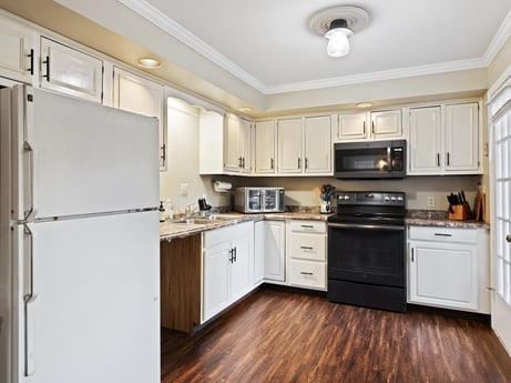 A kitchen at 1061 Muncy St featuring: cabinetry, property, countertop, building, kitchen appliance, home appliance, kitchen, kitchen stove, drawer, interior design