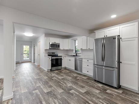 A kitchen at 127 Shore Dr featuring: cabinetry, countertop, furniture, property, building, drawer, kitchen, kitchen stove, chair, home appliance