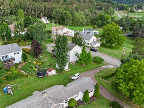 An image featuring plant, property, building, tree, land lot, architecture, urban design, neighbourhood, grass, vehicle at 105 Thomas St.