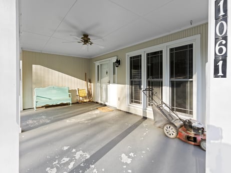 An image featuring tire, wheel, interior design, ceiling fan, building, wood, floor, flooring, real estate, window at 1061 Muncy St.