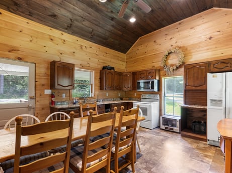 An image featuring furniture, window, table, building, chair, wood, interior design, architecture, floor, flooring at 1039 Old Bernice Rd.