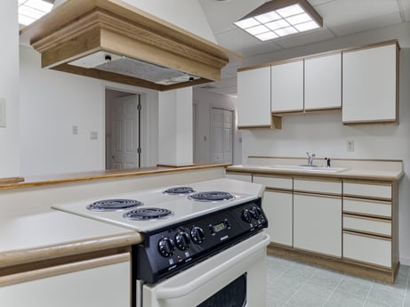 A kitchen at 218 Point Rd featuring: cabinetry, countertop, property, building, furniture, gas stove, kitchen stove, cooktop, kitchen, kitchen appliance
