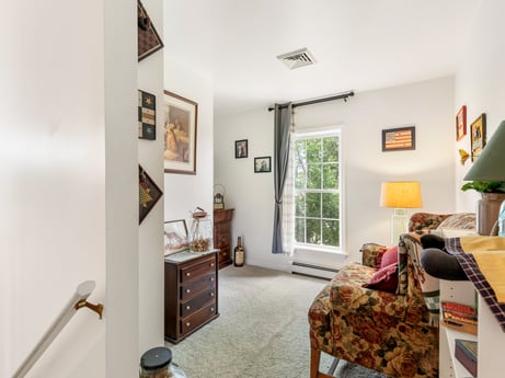 An image featuring picture frame, wood, drawer, floor, cabinetry, flooring, window, comfort, chest of drawers, hardwood at 105 Thomas St.