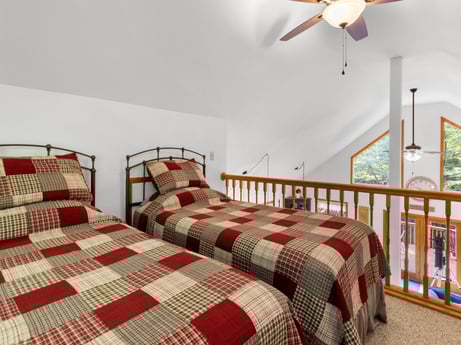 An image featuring furniture, ceiling fan, comfort, wood, bed frame, textile, interior design, flooring, pillow, floor at 459 Pine Hill Dr.