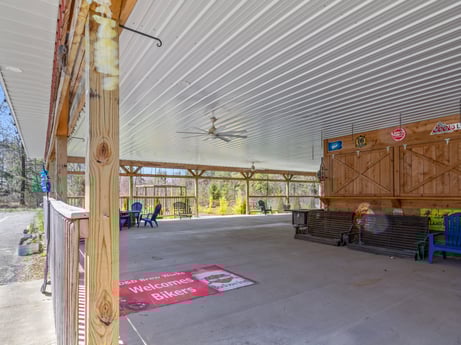 An image featuring asphalt, wood, floor, road surface, flooring, composite material, shade, gas, engineering, city at 4741 US-220.