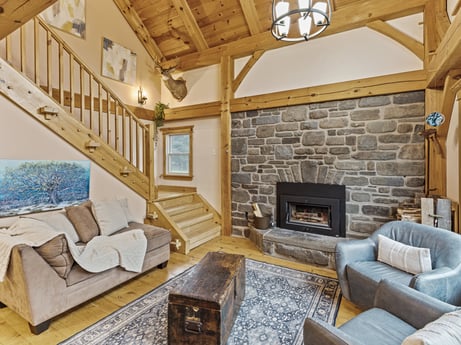 An image featuring property, furniture, couch, wood, living room, interior design, floor, flooring, picture frame, wall at 144 Milton Ln.