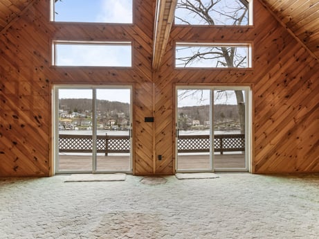 An image featuring wood, fixture, interior design, floor, window, wood stain, beam, door, hardwood, shade at 815 Lakeside Dr.