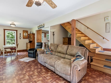 An image featuring brown, furniture, picture frame, property, couch, wood, interior design, lighting, ceiling fan, living room at 145 Nichols Ln.