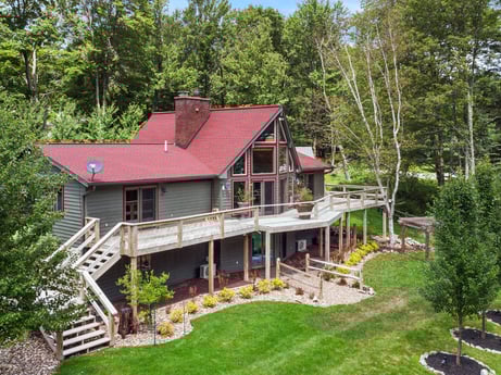An image featuring plant, building, window, tree, wood, land lot, house, grass, cottage, siding at 276 Mountain View Ln.