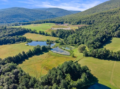 An image featuring water resources, sky, mountain, cloud, ecoregion, plant, natural landscape, tree, highland, land lot at 735 Midnight Ln.