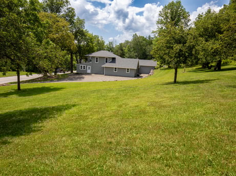 An image featuring plant, cloud, sky, building, tree, natural environment, natural landscape, house, land lot, cottage at 17899 US-6.